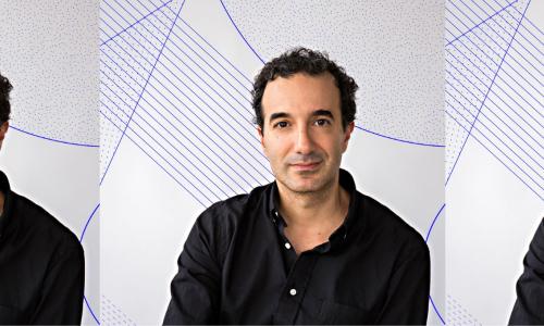 Portrait of Jad Abumrad positioned in front of a gray background with purple lines and shapes intersecting on top of the background. Jad is sporting a black button down and tousled black hair.