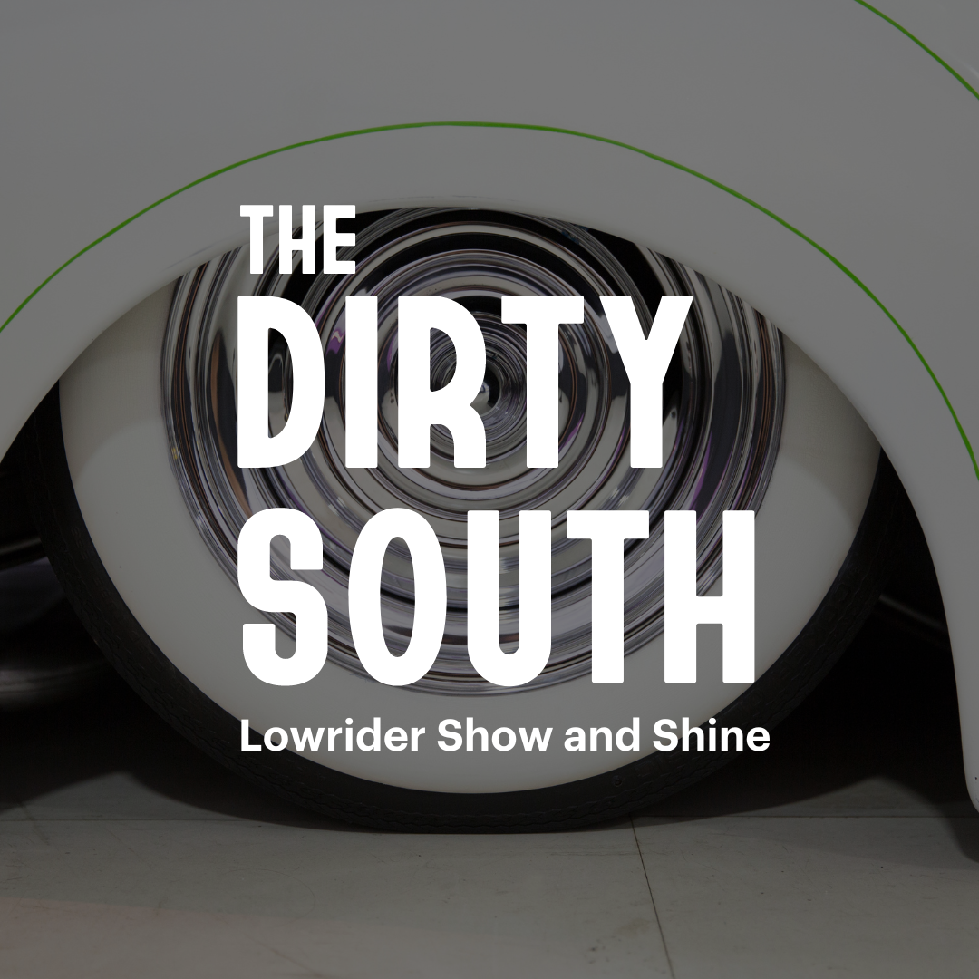 Close up of a white wheel on a white lowrider car. White text overlay reads, “The Dirty South” and “Lowrider Show and Shine”.