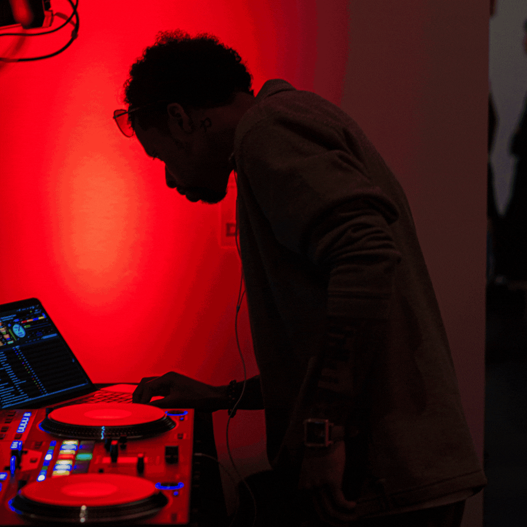 Rotating gif of three images captured at an MCA Denver party. Two feature a DJ under a hue of red light and another shows a crowd in a gallery. 