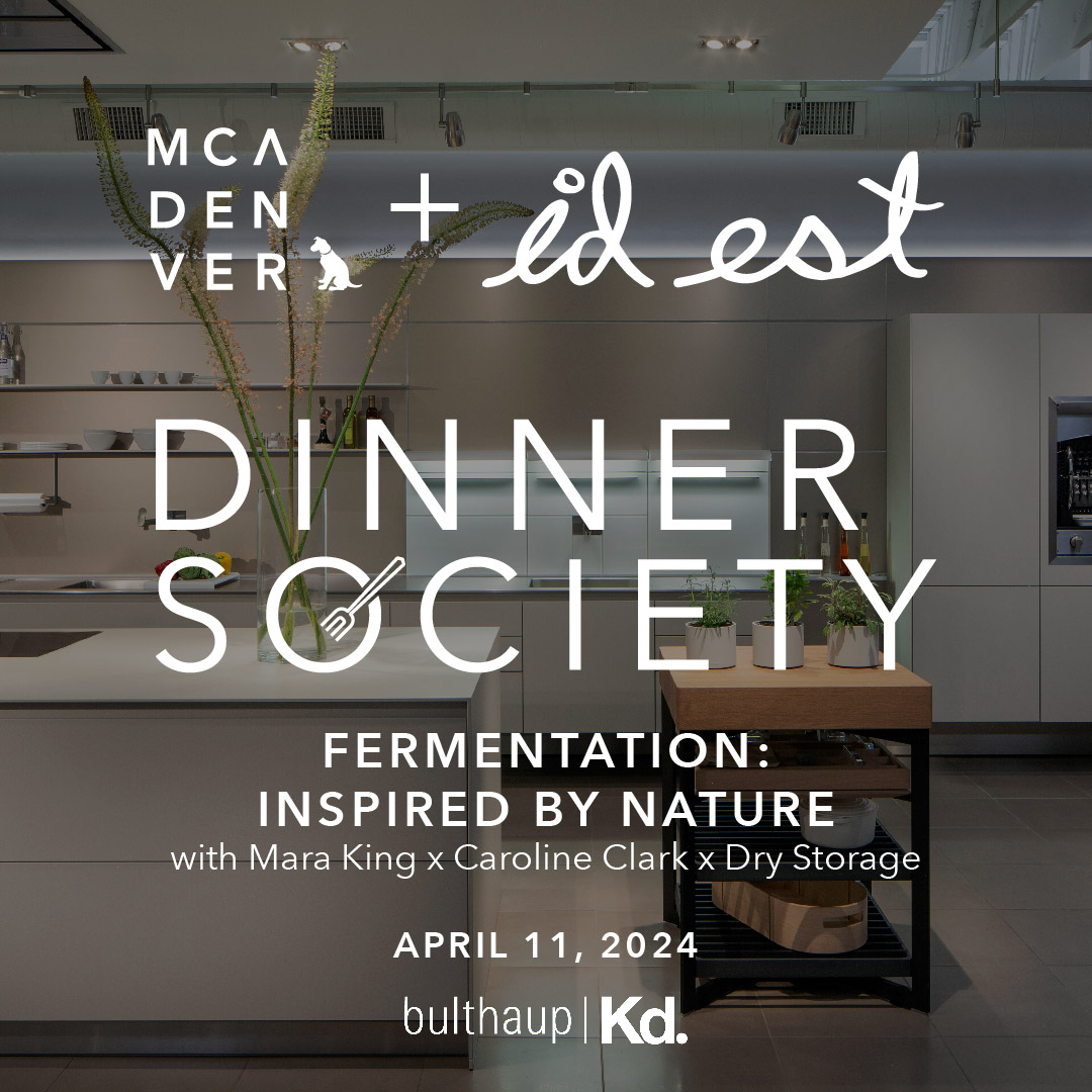 Kitchen showroom with white text overlay that reads, "Dinner Society".