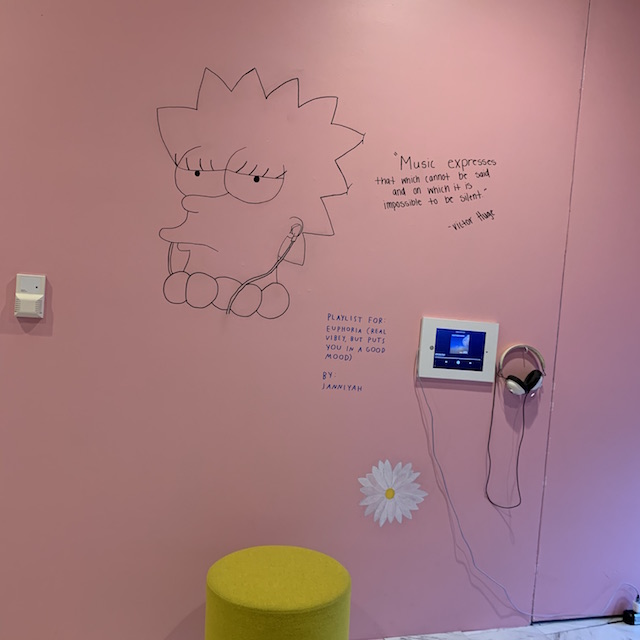Line drawing of lisa simpson on a pink wall listening to music. A monitor is attached to the wall with white headphones. Text reads Janniyah - Euphoria (Real vibey, but puts you in a good mood)