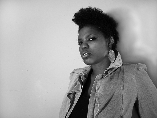 Black and White photo of the artist, Ebony G. Patterson