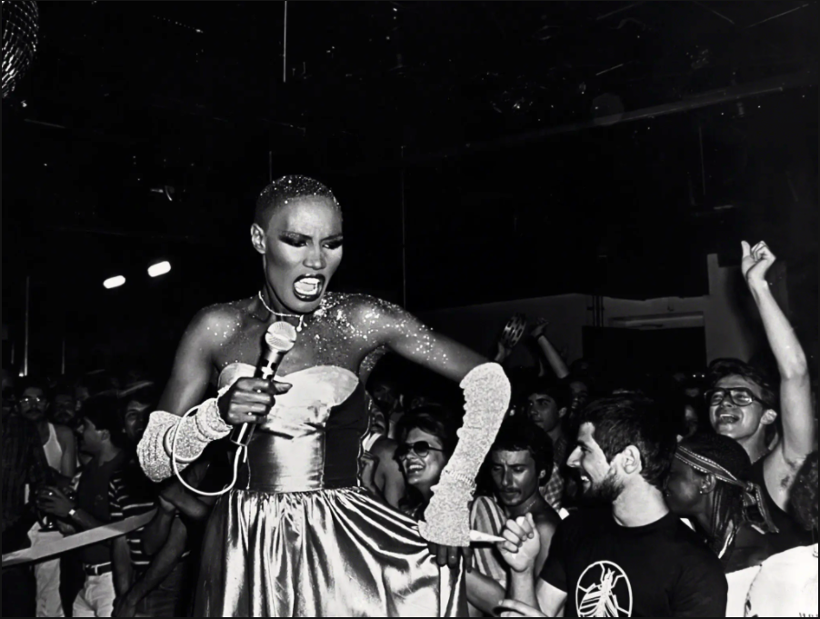 black and white photo of Grace Jones performing at a nightclub