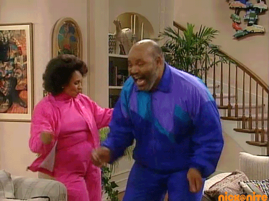Animated image from The Fresh Prince of BelAir. A middle aged man and woman are in pink and blue track suits. They are dancing in their house. ﻿
