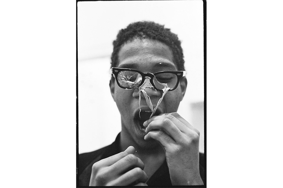 Silly Putty photo: Jean-Michel Basquiat performing in the apartment he shared with Alexis Adler, c. 1979–1980. Archival pigment print, 10 1/2 x 8 inches. Photograph by Alexis Adler. 