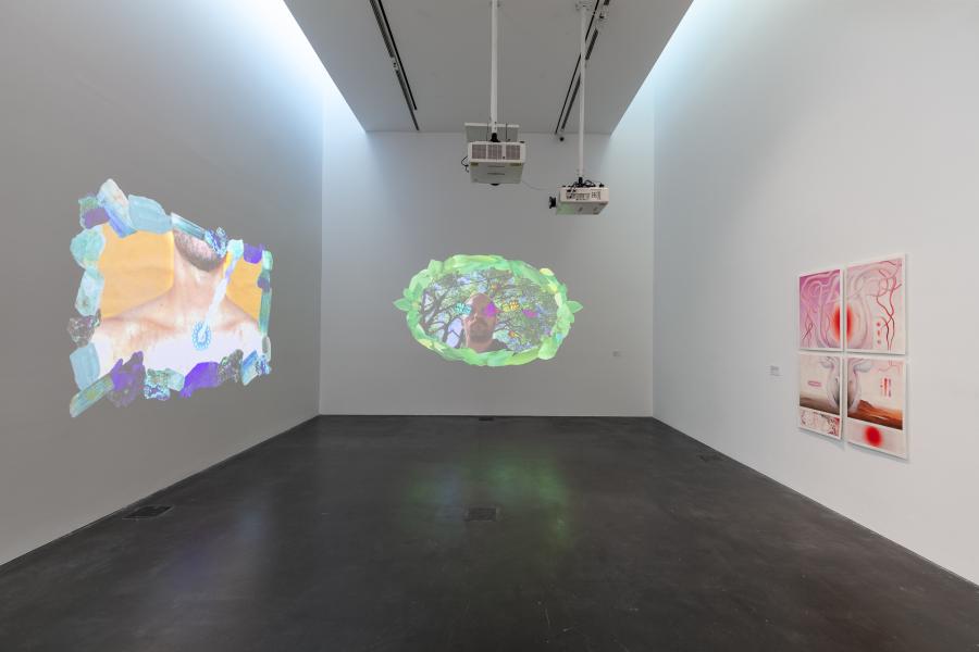 Two colorful video projections on two different walls in an MCA Denver gallery.