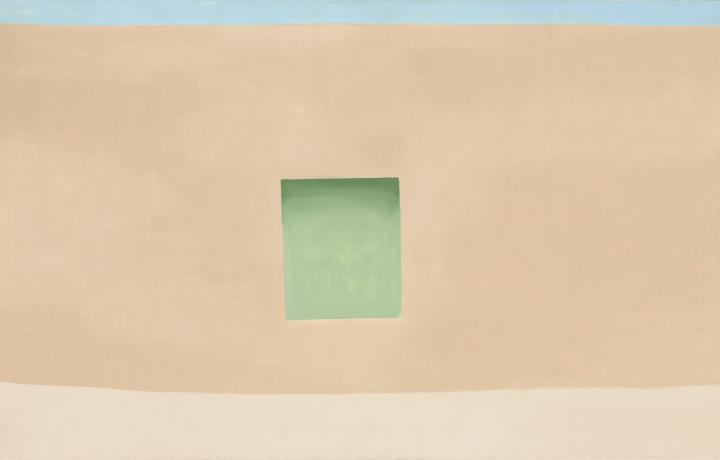A painting by Georgia O’Keeffe in soft pastel colors. A blue line runs across the top of the painting suggesting a clear sky while a sandy colored line on the bottom of the painting suggests ground. In the center is an adobe colored shape and within that is a seafoam square.