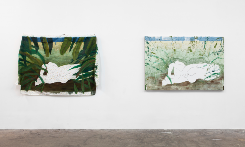 A white gallery with two abstract, landscape paintings hung side by side. There is a figure at the center of each painting, and the colors included in the works are gray, brown, blue, and green. 