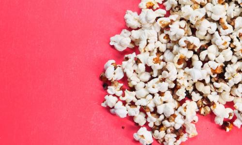 Popcorn on a red background.