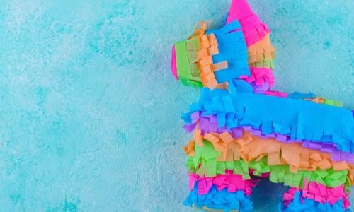 Colorful pinata on a blue background.